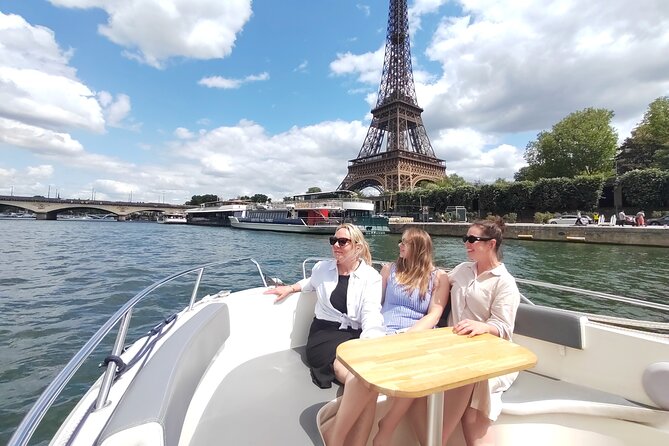 Couple on a Seine River cruise enjoying the views of Paris