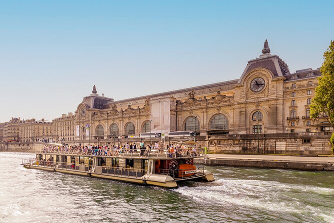 Landmarks of Paris illuminated along the Seine River during a cruise