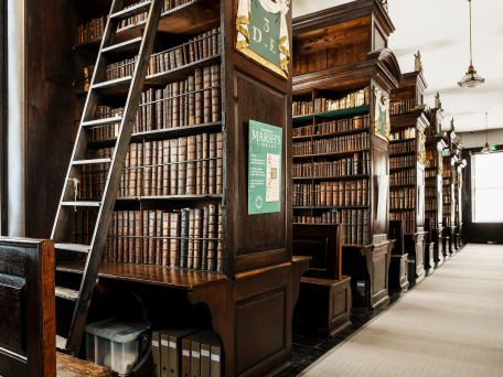 Interior of Marsh's Library in Dublin, with shelves filled with historic books.