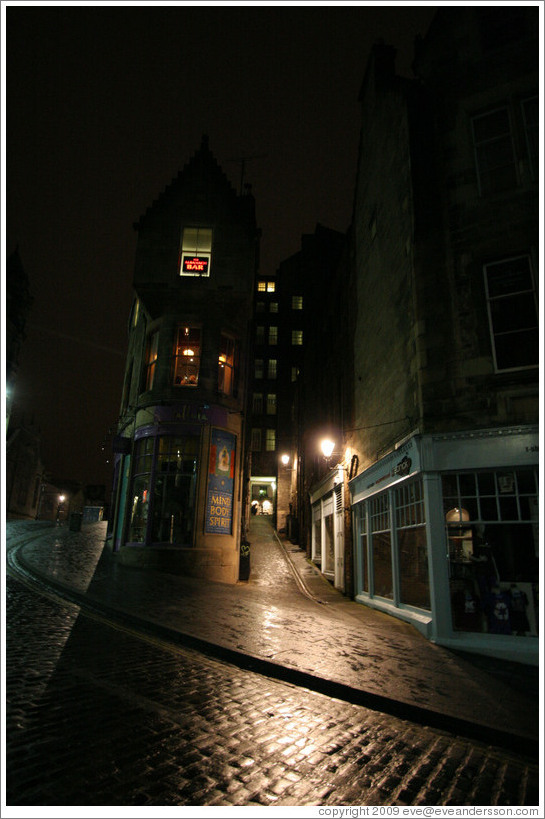 A narrow, dark close in Edinburgh's Old Town at night