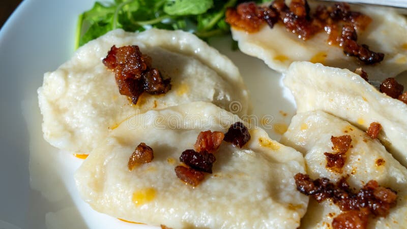 A plate of traditional Polish pierogi, showcasing the variety of fillings.