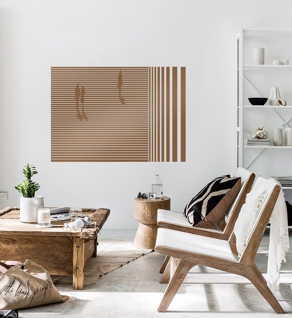 A close-up view of a detailed stencil street art piece on a weathered wall in Berlin, highlighting its urban aesthetic.