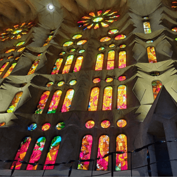 Interior view of Sagrada Familia showcasing the vibrant stained glass windows