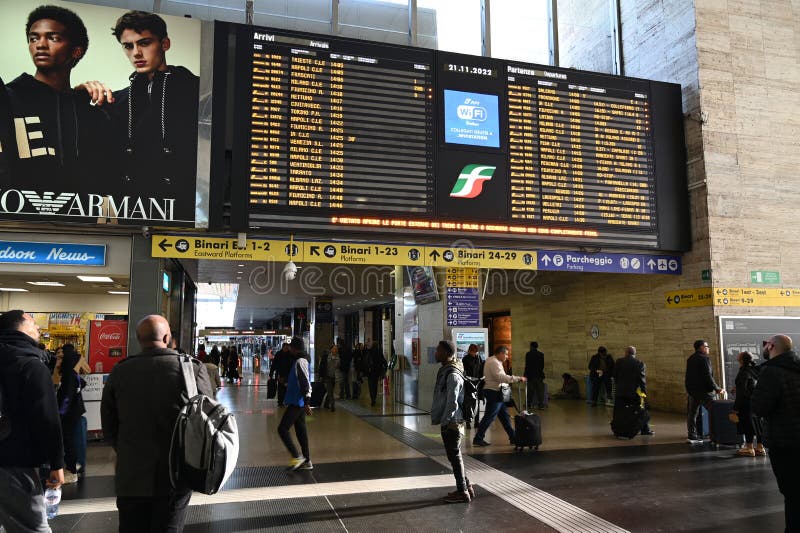 Interior view of a modern Rome metro station showing passengers