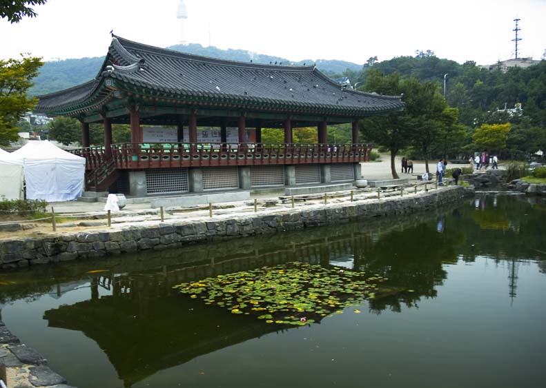 Charming traditional Korean houses (Hanoks) lining a narrow street in Bukchon Village, Seoul.