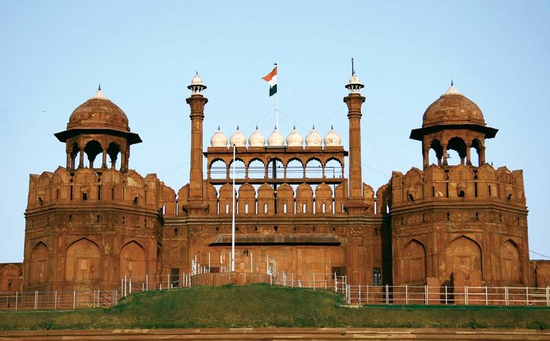 The imposing red sandstone walls of the Red Fort in Delhi.