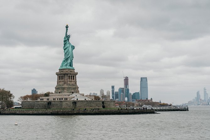 View of the Statue of Liberty and Ellis Island from a ferry in New York Harbor