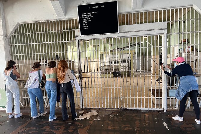 Inside view of an Alcatraz prison cell block with an audio tour device