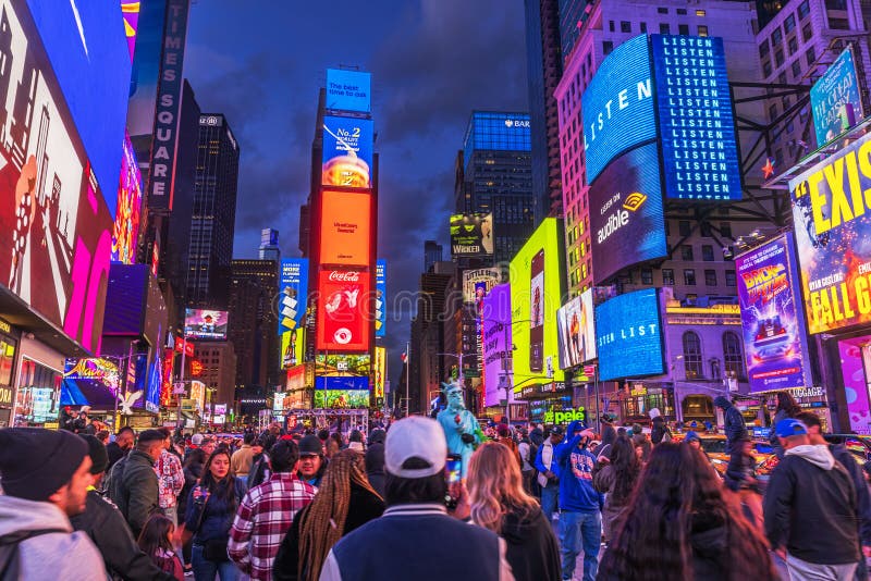 A vibrant and colorful scene of Times Square at night, illuminated by numerous billboards and digital screens