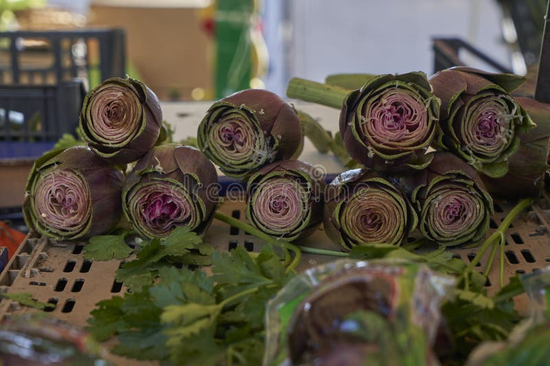 A lively Italian market stall brimming with colorful, fresh fruits and vegetables.